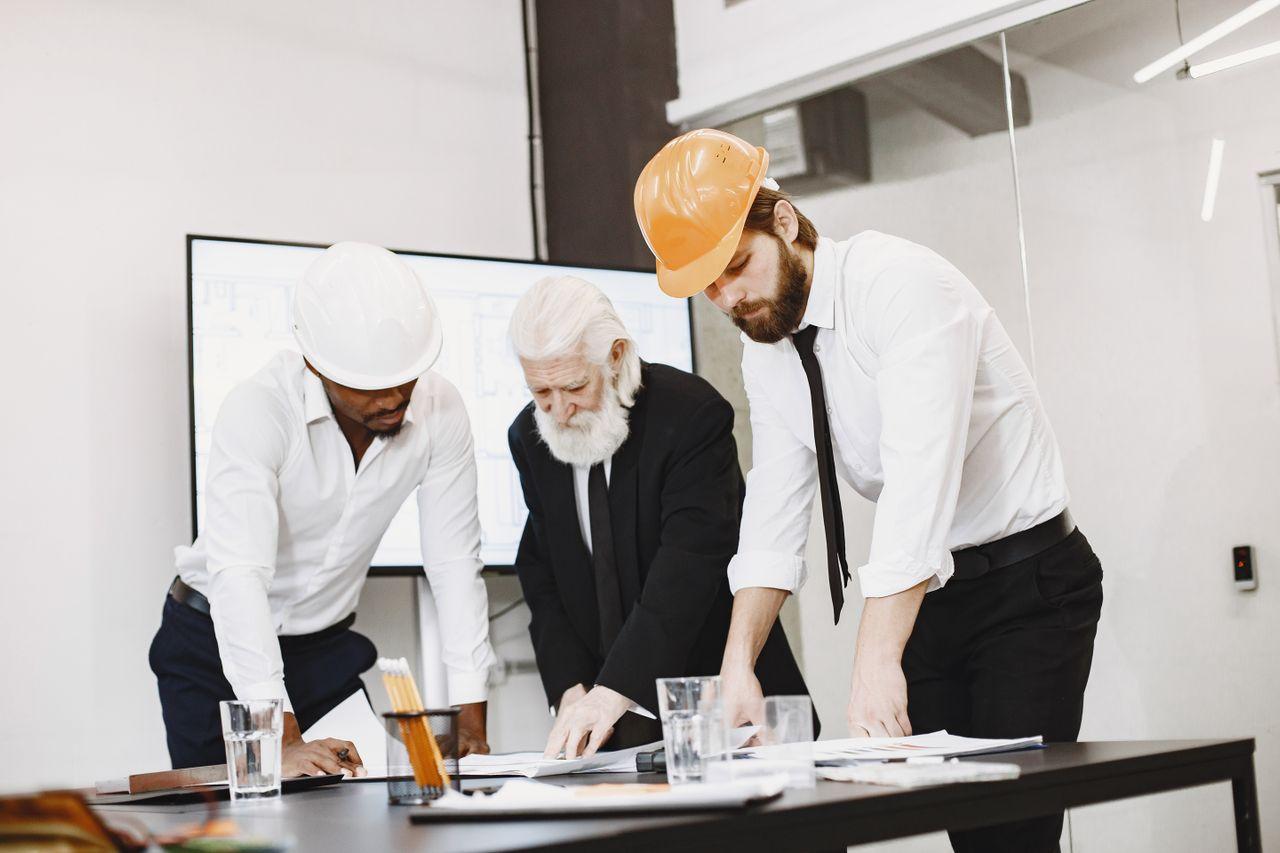 A workplace adviser and manager reviewing an operational plan